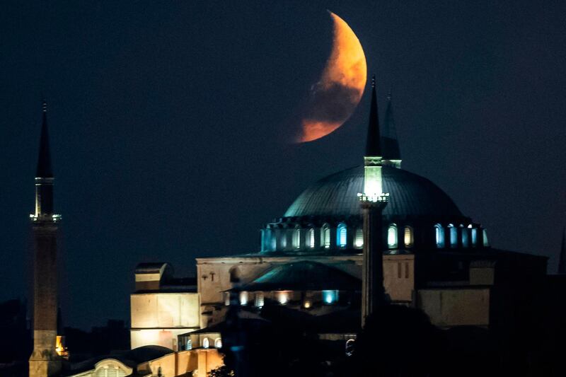 A crescent moon is seen in the sky over Hagia Sophia in Istanbul, Turkey.  AFP