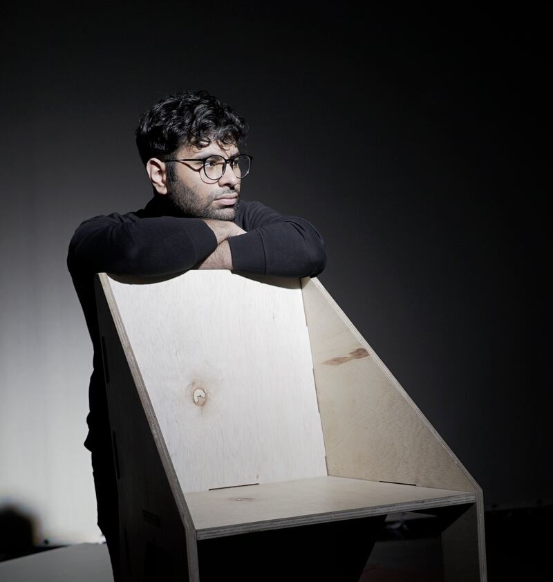 Cyrus Kheshwalla poses with his creation, The Anychair, which can be assembled without tools. Photo: Cyrus Kheshwalla