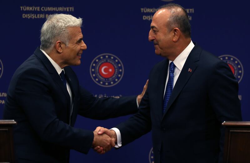 Turkish Foreign Minister Mevlut Cavusoglu (R) and Israeli Foreign Minister Yair Lapid (L) attend a press conference after their meeting in Ankara, Turkey. EPA / STR