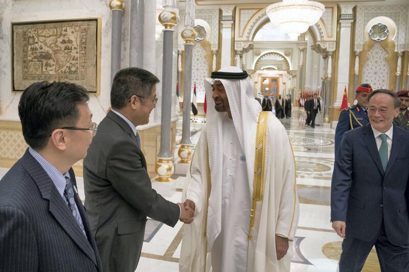 ABU DHABI, UNITED ARAB EMIRATES -October 29, 2018: HH Sheikh Mohamed bin Zayed Al Nahyan, Crown Prince of Abu Dhabi and Deputy Supreme Commander of the UAE Armed Forces (2nd R), greets a member of the delegation accompanying HE Wang Qishan, Vice President of China (R), during a reception at the Presidential Palace.
( Hamad Al Kaabi / Crown Prince Court - Abu Dhabi )
---