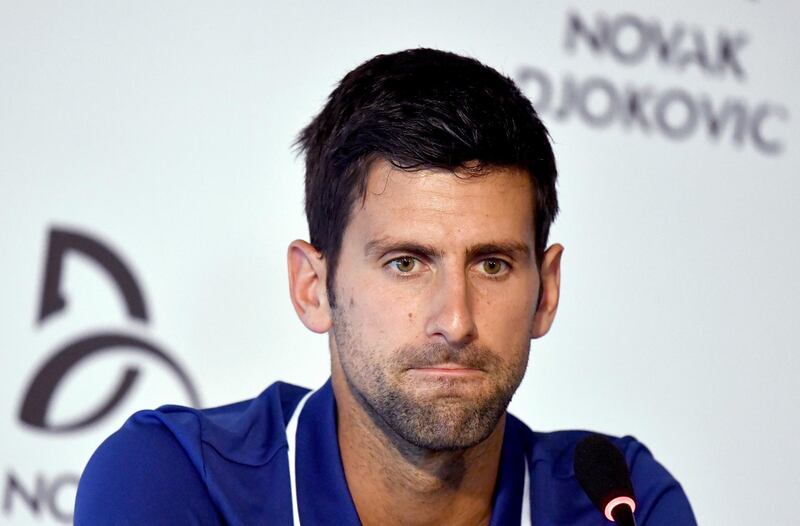 FILE - In this Wednesday, July 26, 2017 file photo, tennis player Novak Djokovic pauses during a press conference in Belgrade, Serbia. Novak has withdrawn from the Mubadala WTC exhibition event due to pain in his right elbow. The Serbian star was scheduled to return to tennis on Friday, Dec. 29, 2017 after being out of the game for nearly six months.(Andrej Isakovic, Pool Photo via AP, File)