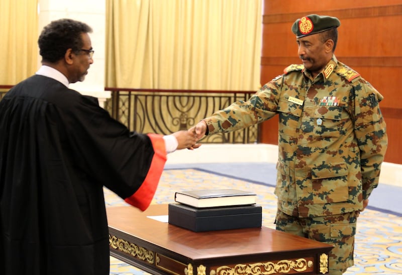A picture released by Sudan's Presidential Palace shows General Abdel Fattah al-Burhan, the head of Sudan's ruling military council, during a swearing in ceremony in Khartoum on August 21, 2019. Burhan was sworn today as chairman of Sudan's new sovereign council that will steer the country through a three-year transition to civilian rule. "General Abdel Fattah al-Burhan Abdel Rahman was sworn in as president of the sovereign council," the official SUNA news agency reported.
 / AFP / SUDAN PRESIDENTIAL PALACE / - /  RESTRICTED TO EDITORIAL USE - MANDATORY CREDIT "AFP PHOTO / SUDAN PRESIDENTAIL PALACE" - NO MARKETING NO ADVERTISING CAMPAIGNS - DISTRIBUTED AS A SERVICE TO CLIENTS

