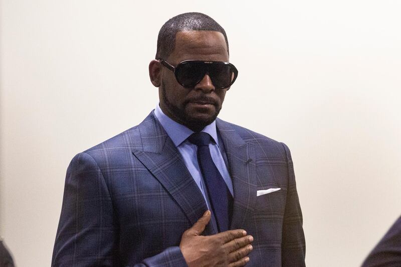 Musician R. Kelly arrives at the Daley Center for a hearing in his child support case at the Daley Center, Wednesday, March 6, 2019, in Chicago. Kelly was charged last month with sexually abusing four females dating back to 1998, including three underage girls. He's pleaded not guilty.   (Ashlee Rezin/Chicago Sun-Times via AP)