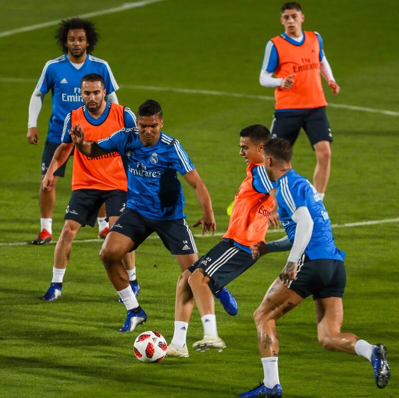 Abu Dhabi, U.A.E., December 17, 2018.  Real Madrid training session at the NYU Abu Dhab football stadium. (centre blue jersey) Casemiro attempts to get the ball from Federico  Valverde (orange jersey)Victor Besa / The NationalSection:  SportsReporter:  John Mc Auley