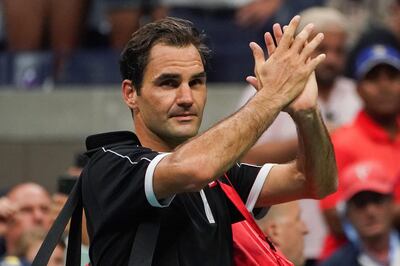 TOPSHOT - Roger Federer of Switzerland walks off the court after losing to Grigor Dimitrov of Bulgaria in their Men's Singles Quarter-finals tennis match during the 2019 US Open at the USTA Billie Jean King National Tennis Center in New York on September 3, 2019.  / AFP / DOMINICK REUTER
