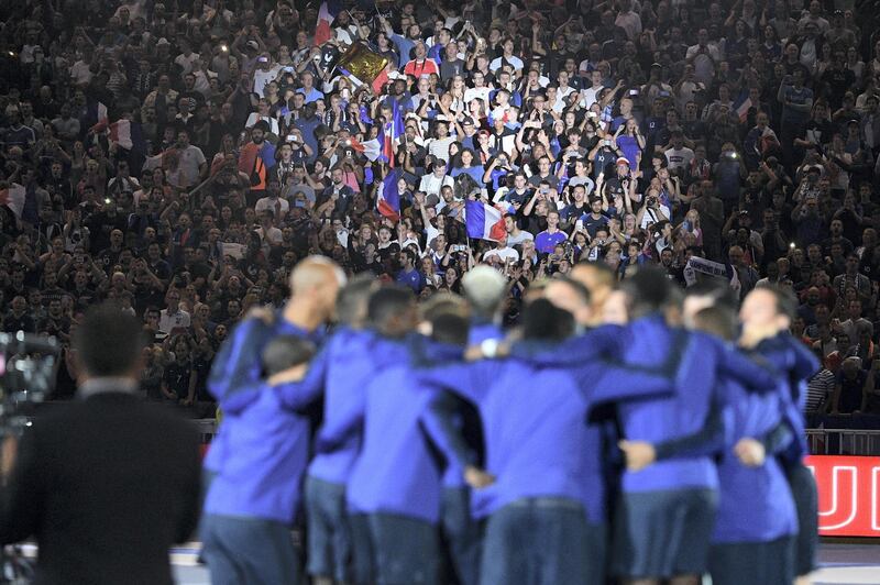 France's team players celebrate during a ceremony for the victory of the 2018 World Cup at the end of the UEFA Nations League football match between France and Netherlands at the Stade de France stadium, in Saint-Denis, northern of Paris, on September 9, 2018. / AFP PHOTO / FRANCK FIFE