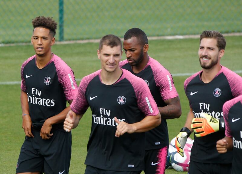 Kevin Trapp, right, and Thilo Kehrer, left, run during a training session. AP Photo