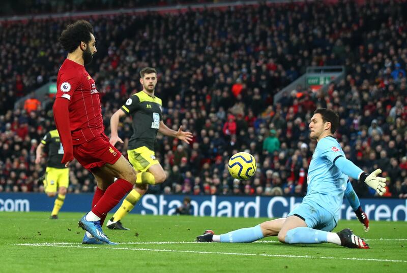 LIVERPOOL, ENGLAND - FEBRUARY 01: Mohamed Salah of Liverpool scores his team's third goal during the Premier League match between Liverpool FC and Southampton FC at Anfield on February 01, 2020 in Liverpool, United Kingdom. (Photo by Julian Finney/Getty Images)