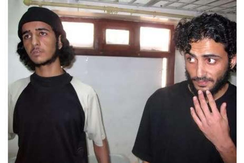 Mubarak Ali Hadi al Shabwani, right, and Mansour Saleh Dalil at the state security court in Sana'a yesterday.