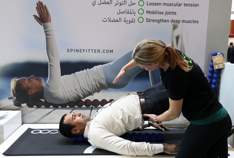 Anna Sattler, physio therapist at Spinefitter, demonstrates exercises to make mobilisation easier for the spine and loosen the muscles 