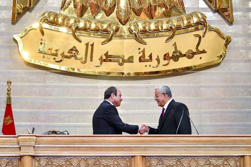Egypt's President Abdel Fattah El Sisi shakes hands with Parliament Speaker Hanafi El Gebali during the former's inauguration for a third presidential term. AFP