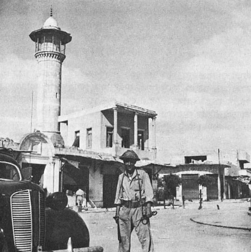 An Israeli soldier in central Al Lydd in 1948.