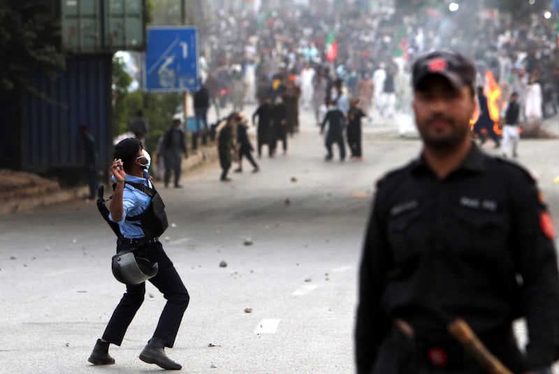 Officers clash with supporters of the Pakistan Tehrik-e-Insaf in Islamabad. EPA