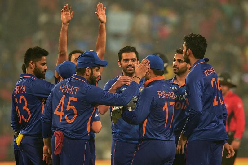 India players celebrate the dismissal of  New Zealand's Jimmy Neesham during the third T20 at the Eden Gardens in Kolkata on Sunday, November 21, 2021. AFP