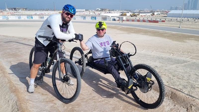 Noel Joyce trying out his adaptive mountain bike with Scott Cannie, co-director of athletics at NYU, Abu Dhabi. Photo: Scott Cannie