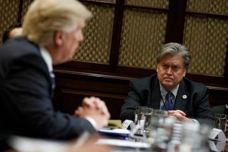 White House Chief Strategist Steve Bannon listens at right as President Donald Trump speaks during a meeting on cyber security in the Roosevelt Room of the White House in Washington, Tuesday, Jan. 31, 2017. (AP Photo/Evan Vucci)