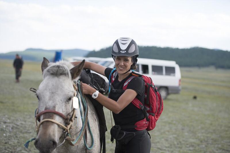 Uma Mencia prepares to mount a horse to continue the Mongol Derby. Courtesy Saskia Marloh