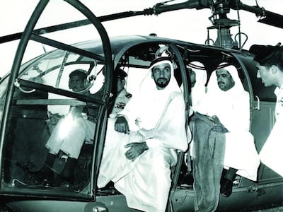 Sheikh Zayed rides in a helicopter during a visit to Pakistan in the 1970s. National Archives