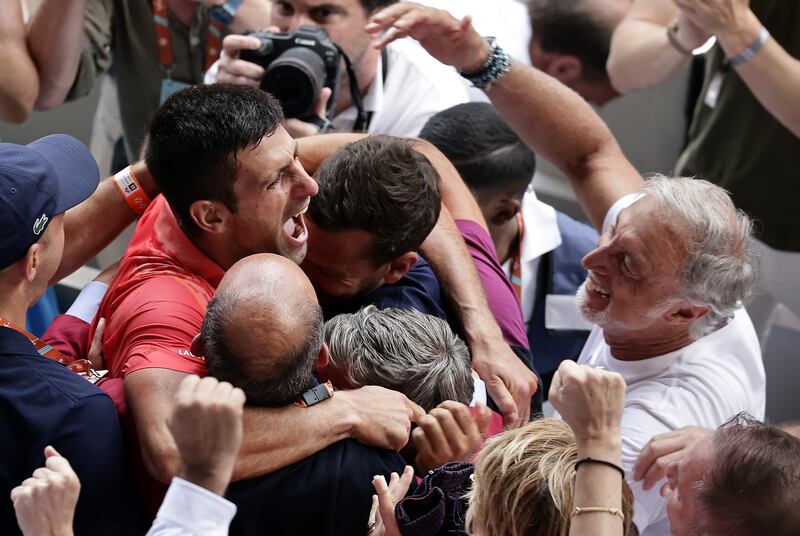 Novak Djokovic celebrates with his team and family after the match. EPA