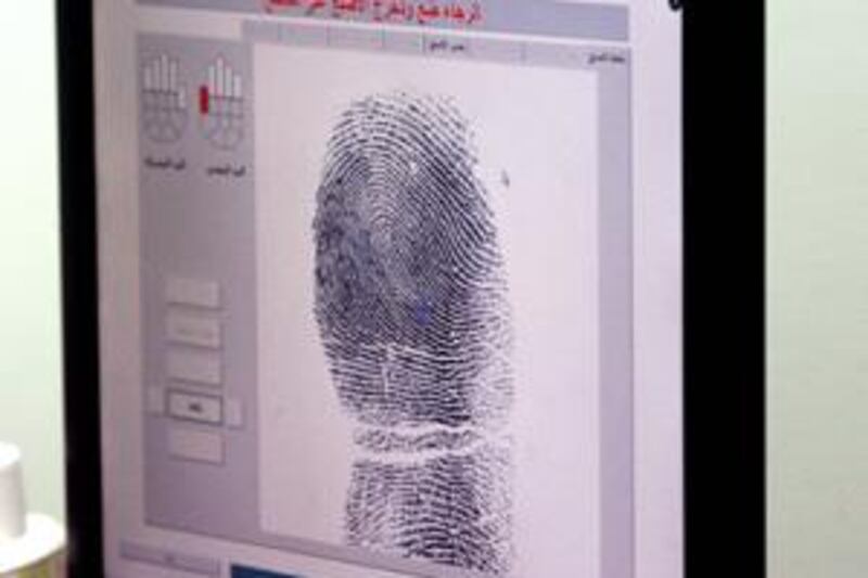 A fingerprint taken for an ID card is shown up on a computer screen at the Emirates Identity Authority in Abu Dhabi.