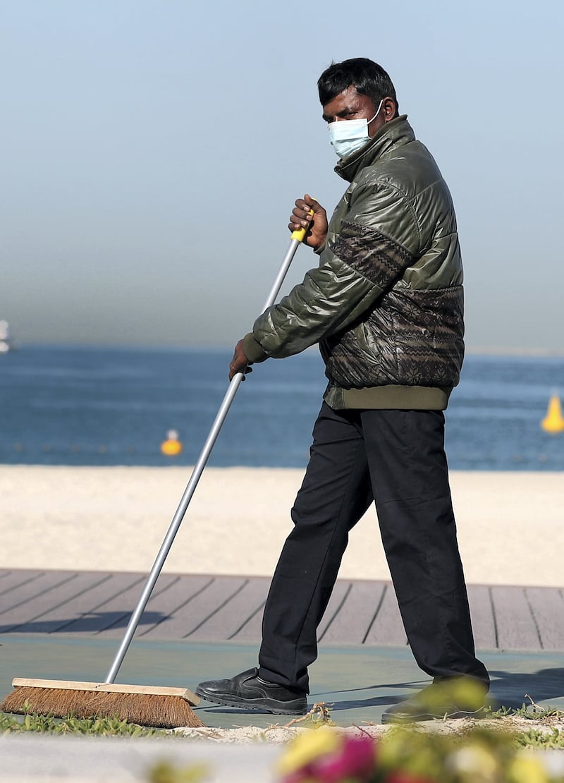 Dubai, United Arab Emirates - Reporter: N/A. News. Weather. A man wears a big coat on the beach as the colder weather sets in. Dubai. Tuesday, January 5th, 2021. Chris Whiteoak / The National