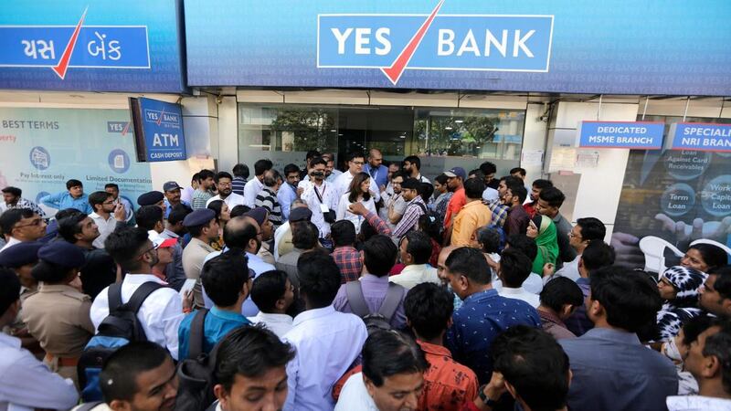 Indian depositors crowd for withdrawals outside a Yes Bank branch in Ahmedabad last week. AP