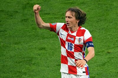 Croatia's midfielder Luka Modric celebrates with the fans after their win in the UEFA EURO 2020 Group D football match between Croatia and Scotland at Hampden Park in Glasgow on June 22, 2021. / AFP / POOL / ANDY BUCHANAN
