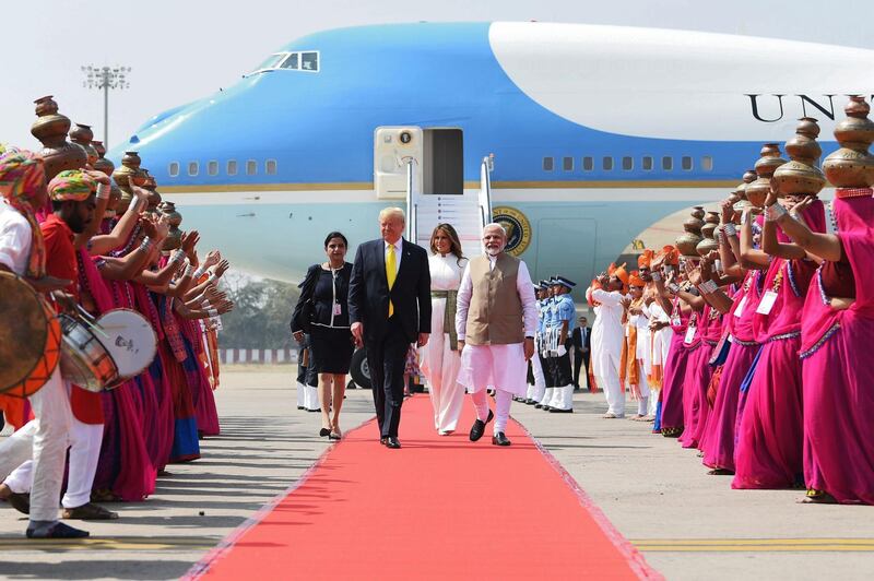US President Donald Trump and First Lady Melania Trump walk with Indian Prime Minister Narendra Modi upon their arrival at Sardar Vallabhbhai Patel International Airport in Ahmedabad.   AFP