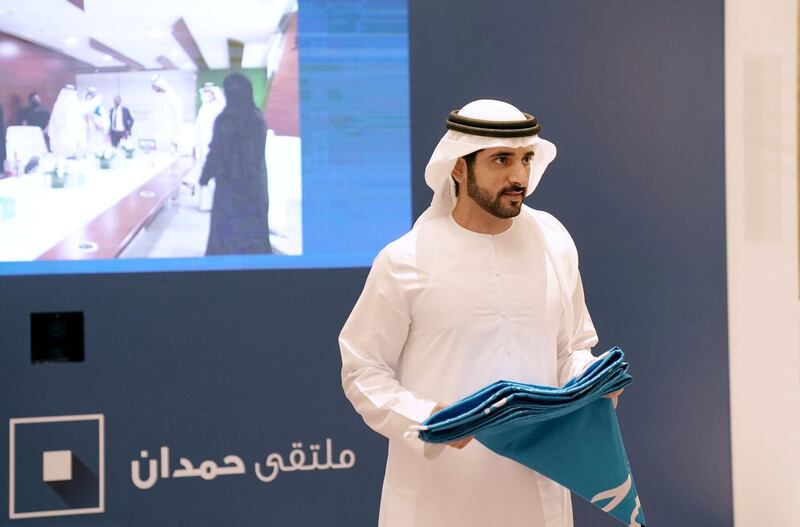           Sheikh Hamdan bin Mohammed hands over the Dubai Electricity and Water Authority the banner of the Hamdan bin Mohammed Program for Government Services 2020. WAM                           