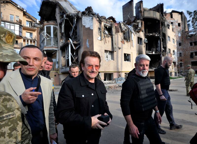 Bono, vocalist with the Irish rock band U2, sees shelling damage in a residential area in the Ukrainian town of Irpin, near Kyiv. AFP