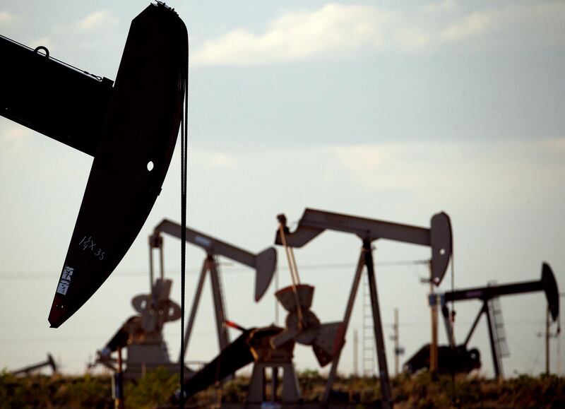 FILE - In this April 24, 2015, file photo, pumpjacks work in a field near Lovington, N.M.  Oil industry and environmental groups say they expect the Environmental Protection Agency to release a proposed rule over the next few days that will roll back requirements on detecting and plugging methane leaks at oil and gas facilities (AP Photo/Charlie Riedel, File)