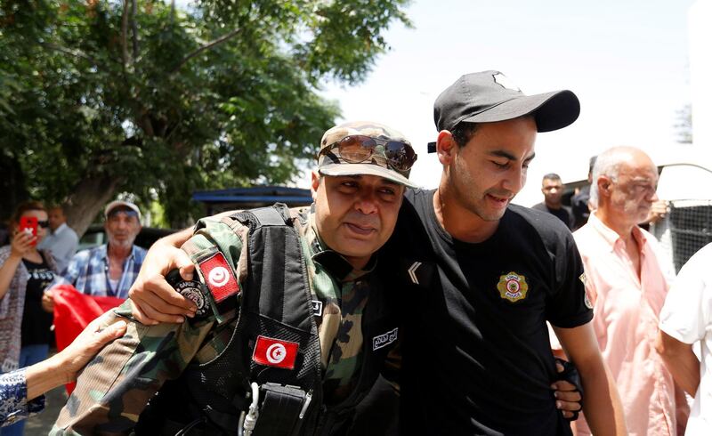 Police officers mourn Anis El Werghi during his funeral in Tunis on July 9, 2018. The Tunisian security forces member was killed in an ambush near the border with Algeria earlier in the week . Reuters