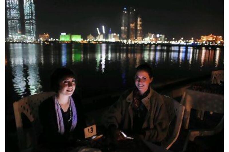 They're usually on the other side of the camera: the filmmakers Alicia Sully, left, and Philippa Young take a break in Abu Dhabi.