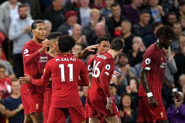 LIVERPOOL, ENGLAND - AUGUST 09: Virgil van Dijk of Liverpool celebrates after scoring his sides third goal during the Premier League match between Liverpool FC and Norwich City at Anfield on August 09, 2019 in Liverpool, United Kingdom. (Photo by Michael Regan/Getty Images)
