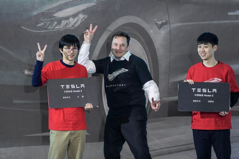 Elon Musk at Tesla's Shanghai factory. In recent weeks, Mr Musk has praised Tesla employees in China for 'burning the 3am oil' while criticising Americans who he described as 'trying to avoid going to work at all'. AP