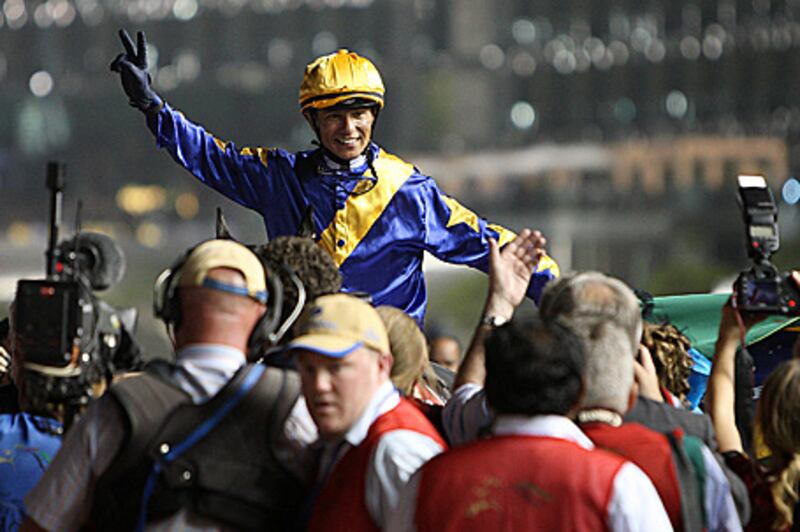 The winning jockey, Tiago Pereira, celebrates after last night's victory on Gloria de Campeao in the Dubai  World Cup, the world's richest horse race.