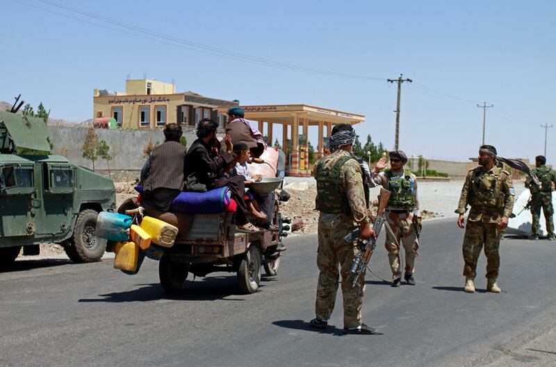 Troops patrol after taking back control of parts of Herat city from the Taliban on Sunday.  AP