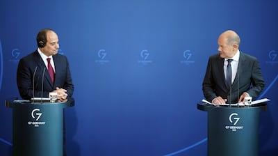 German Chancellor Olaf Scholz, right, speaks alongside Egyptian President Abdel Fattah El Sisi at their joint news conference at the Chancellery in Berlin. EPA