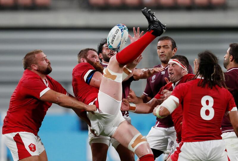 Wales' Jake Ball struggles to keep possession. Reuters