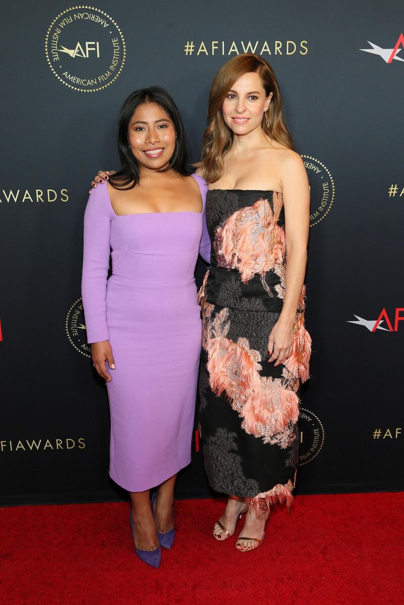 Actress Yalitza Aparicio (left) turns heads in this lilac number, and we love the feather accents on Marina De Tavira's (right) strapless gown. REUTERS