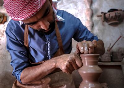 Osama El Adel, an Egyptian pottery maker at the Heritage Village in Abu Dhabi. Victor Besa / The National