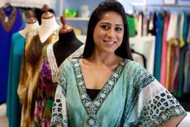 Indian designer Anchal Chanda poses next to her new collection at the Candella store in Dubai. Anchal is based in Delhi, NYC and Dubai and will be selling her latest collections at Harvey Nichols in London. "The best part about being designer is working with the endless possibilities of colour" Anchal says.  (Razan Alzayani / The National)