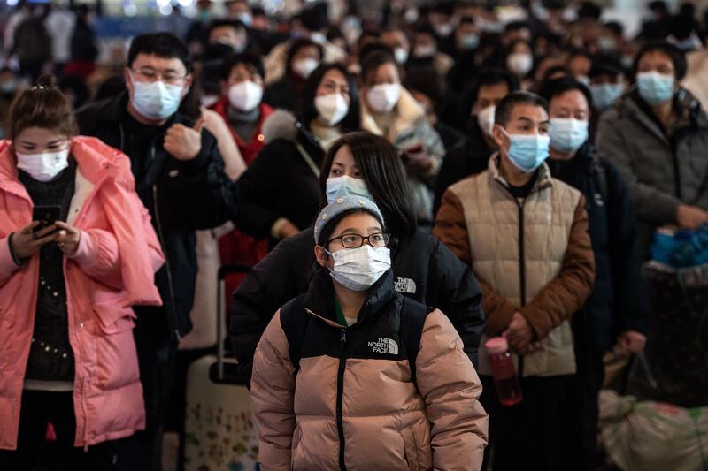 Passengers arrive at Hankou railway station on the first day of peak travel ahead of the Lunar New Year holiday in Wuhan, Hubei province. AFP