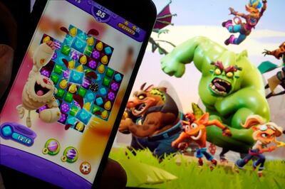Scenes from Candy Crush Saga, left, by Activision Blizzard, and Crash Team Rumble. AP