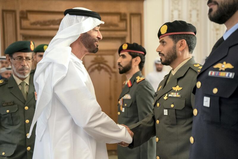 ABU DHABI, UNITED ARAB EMIRATES - October 14, 2019: HH Sheikh Mohamed bin Zayed Al Nahyan, Crown Prince of Abu Dhabi and Deputy Supreme Commander of the UAE Armed Forces () presents medals to members of the UAE Armed Forces.

( Rashed Al Mansoori / Ministry of Presidential Affairs )
---