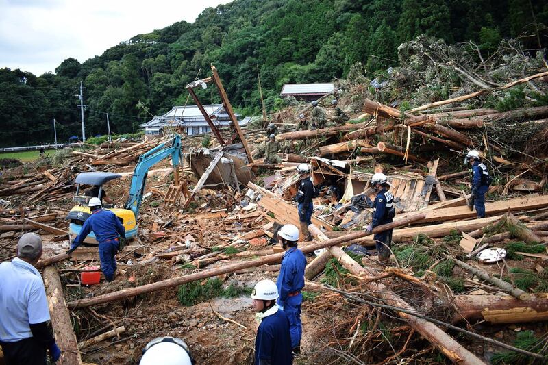 Members of Japan's Self-Defence Forces work at the site of a landslide caused by heavy rain in Ashikita. AFP