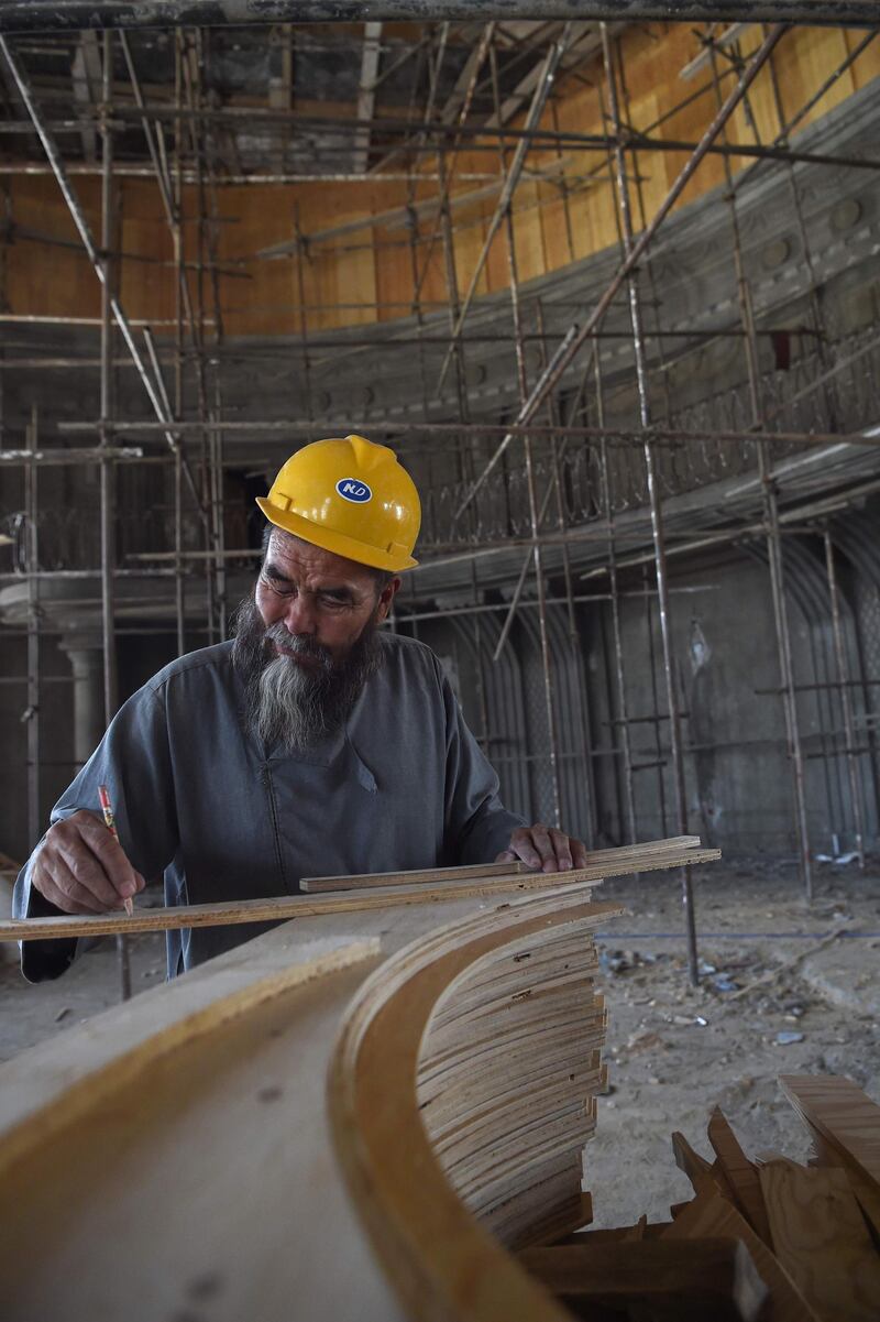 The renovation of Darulaman Palace has been a boon for Afghan craftsmen and suppliers of materials such as wood and marble. AFP