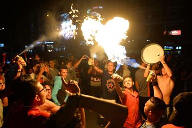 Egyptians celebrate after their team won the 2019 Africa Cup of Nations (CAN) football match between Egypt and Zimbabwe in Cairo on June 21, 2019. AFP 