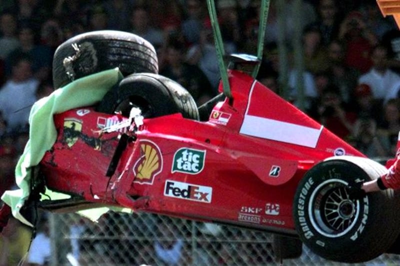 FILE - The July 11, 1999 file photo shows the damaged Ferrari of Germany's Michael Schumacher is lifted onto a flat bed truck, after he crashed into a tire wall on the first lap at Stowe corner, during the British Grand Prix at Silverstone, England. Michael Schumacher said Tuesday, Aug. 11, 2009 he is calling off his much-anticipated Formula One comeback because of lingering injuries from a motorcycling crash earlier this year. The seven-time world champion was to fill in for injured Ferrari driver Felipe Massa and hoped to return at the European Grand Prix in Valencia, Spain, later this month. (AP Photo/Max Nash, file)