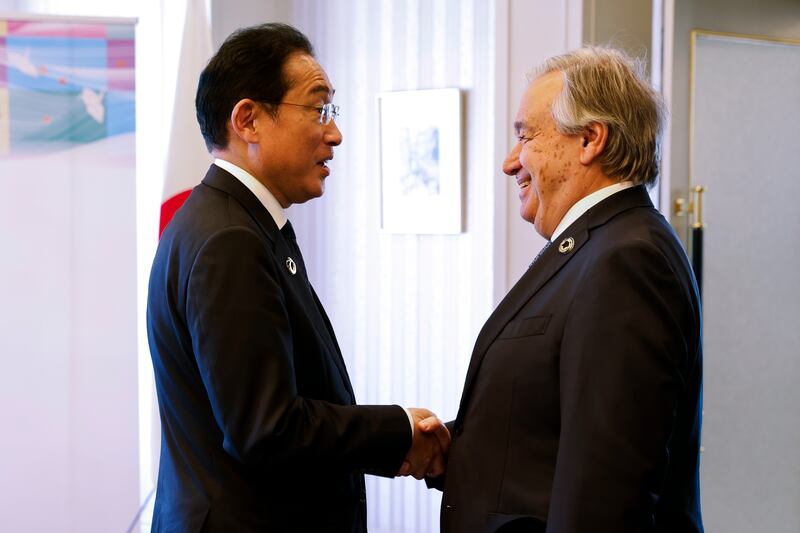 UN Secretary General Antonio Guterres, right, shakes hands with Japan's Prime Minister Fumio Kishida. EPA